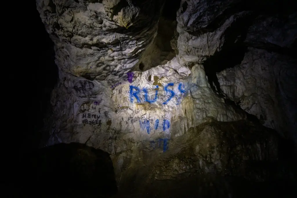 Graffiti sprayed onto the walls of the cave