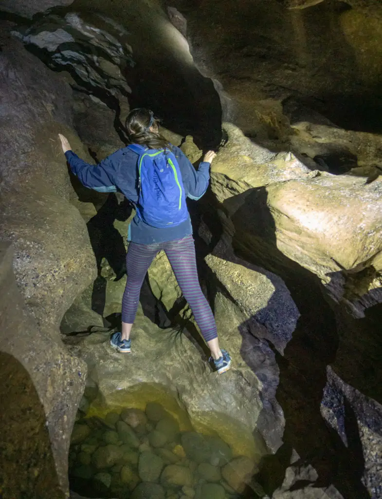 A person negotiating the Clifden Caves