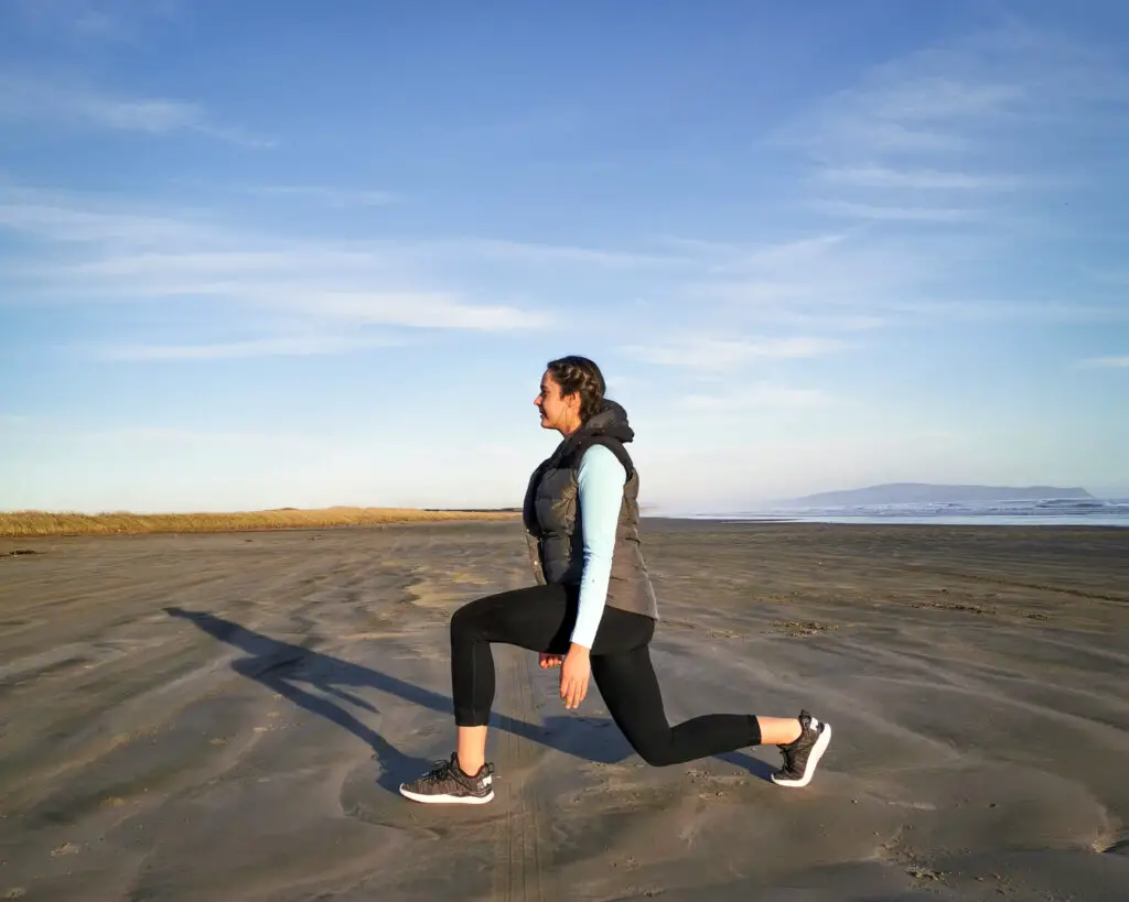 Girl lunging on a beach