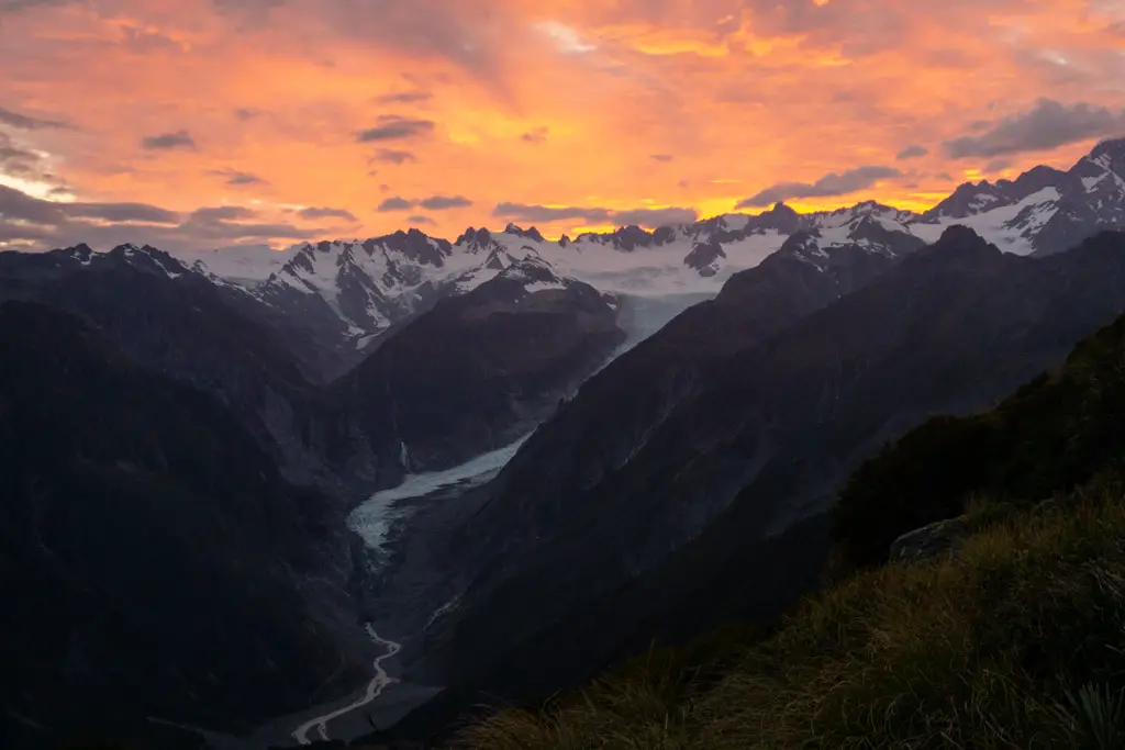 Sunrise over Fox Glacier and the surrounding mountains