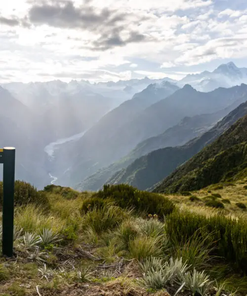 Summit of Mount Fox with views over Fox Glacier and the surrounding mountains including Mt Tasman