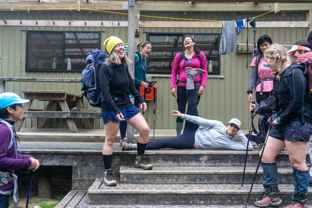 Group of lady hikers outside Mintaro Hut on the Milford Track