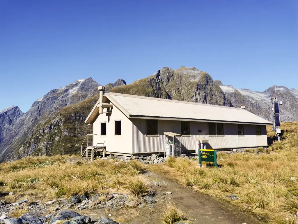 McKinnon Pass shelter with mountains in the background
