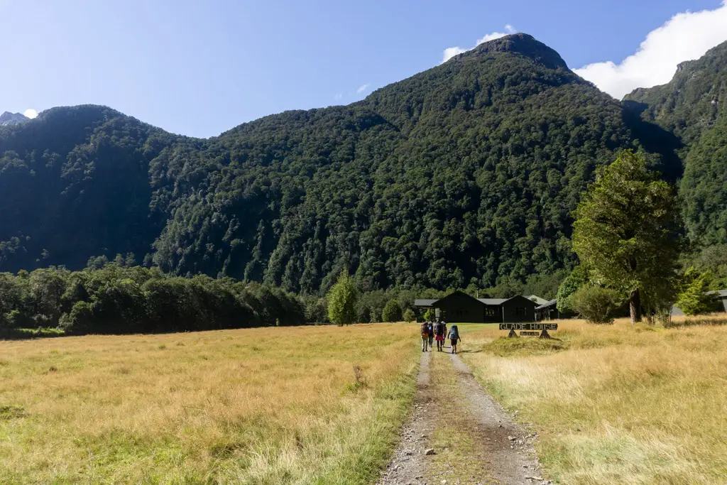 Hikers walking towards Glade House on the Milford Track