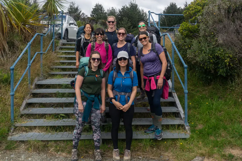 Group of lady hikers standing on steps