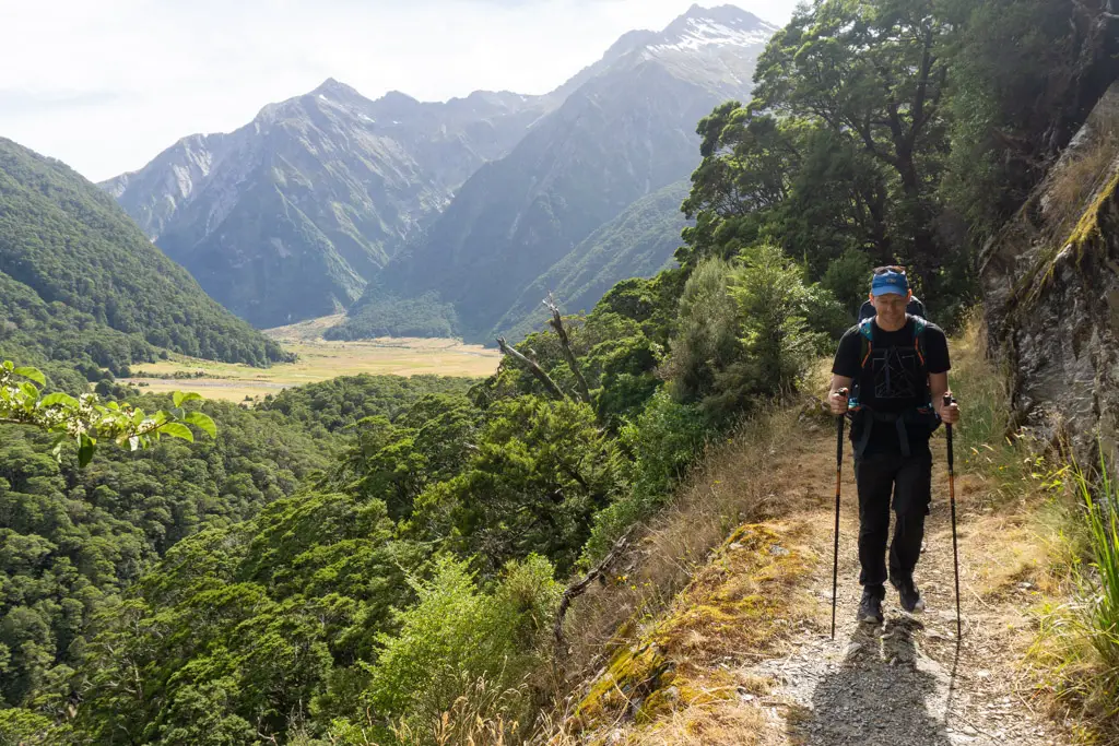 Man walking on the Wilkin-Young Circuit with Siberia Valley in the background