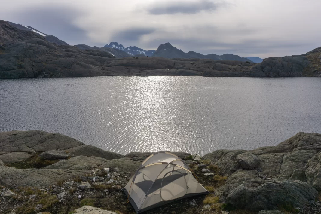Tent set up by tarn next to Lake Nerine