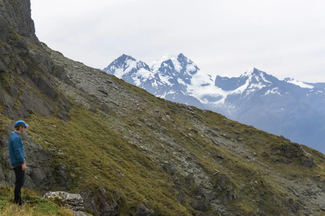 Man admiring the view from North Col in Mt Aspiring National Park