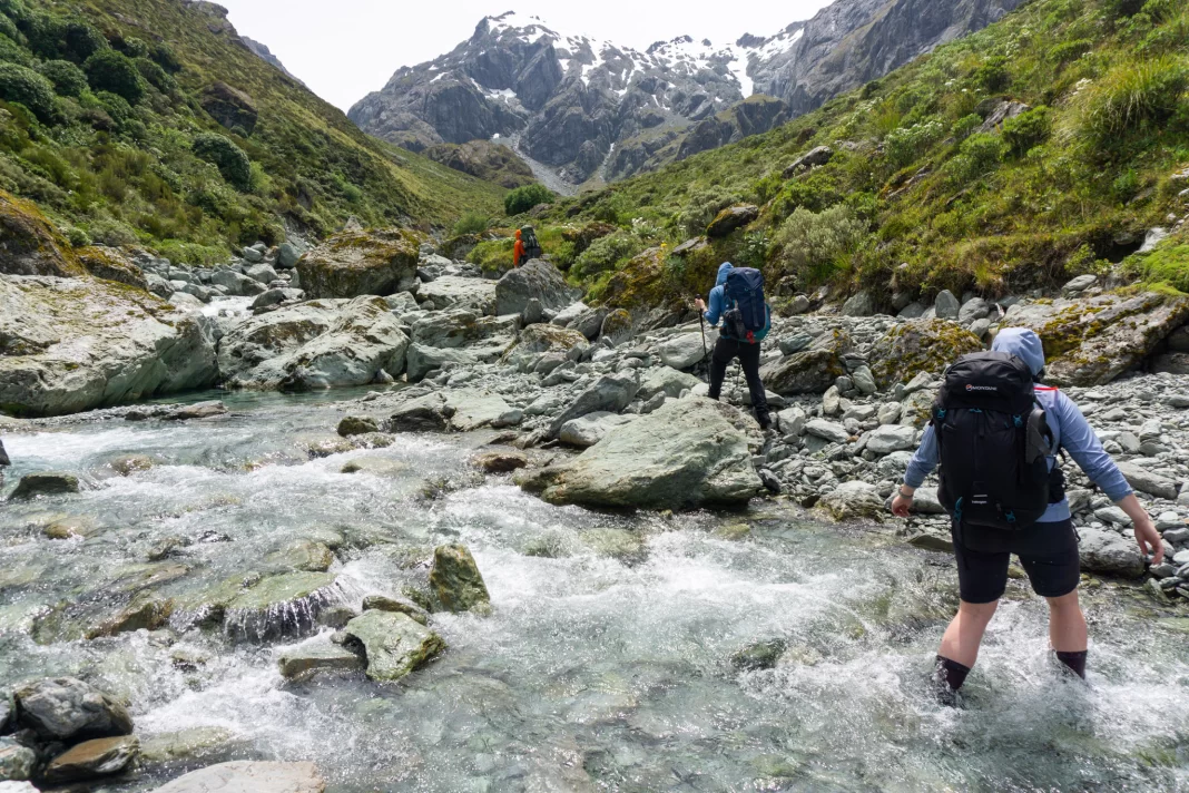 Trampers walking up the North Branch of the Routeburn