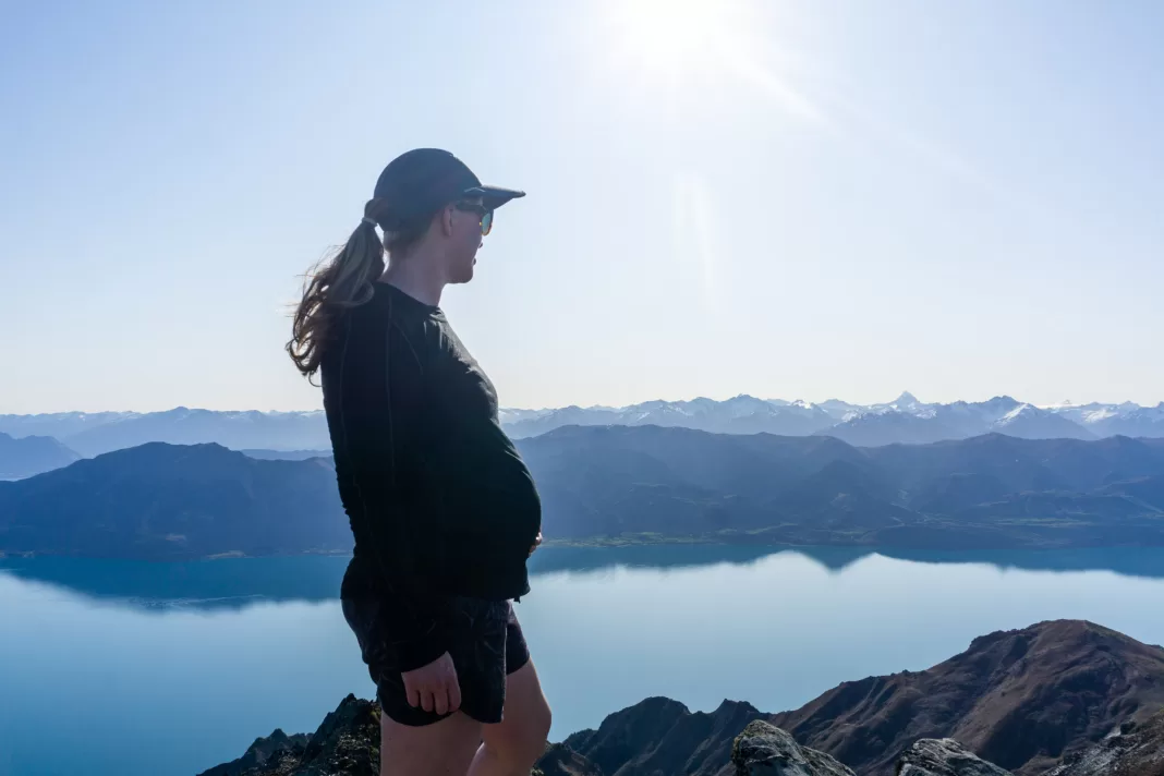 Pregnant lady with Lake Hawea and mountains in the background