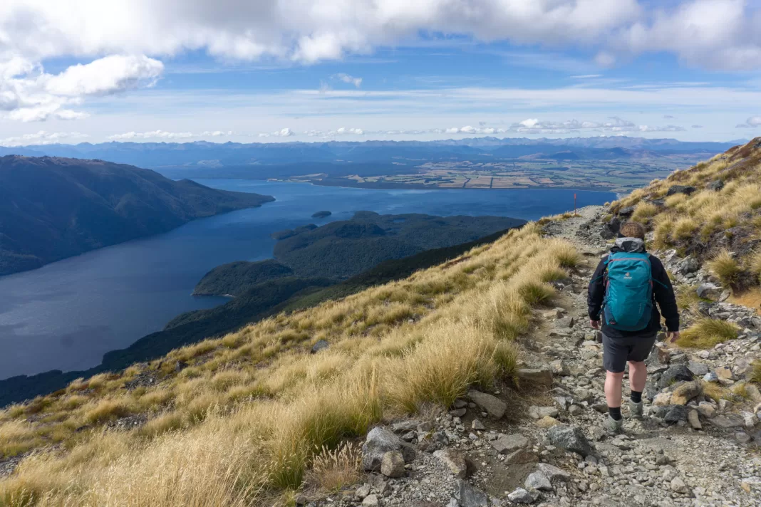 Woman walking the Kepler track during the Summit Challenge