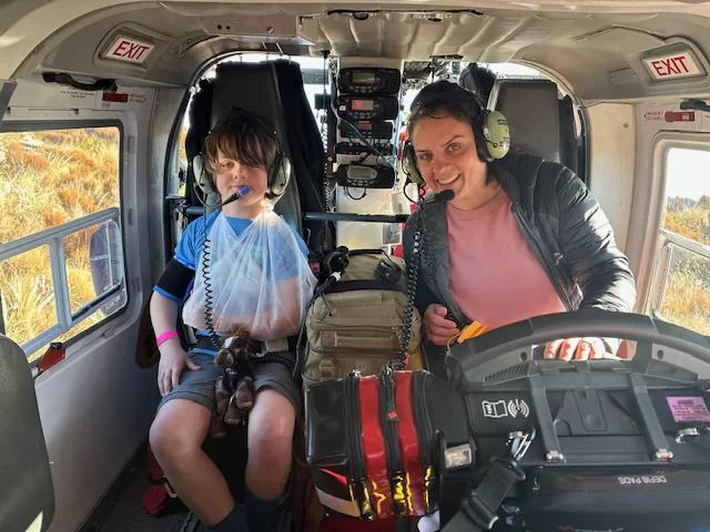 Injured child and his mother in a helicopter, being evacuated