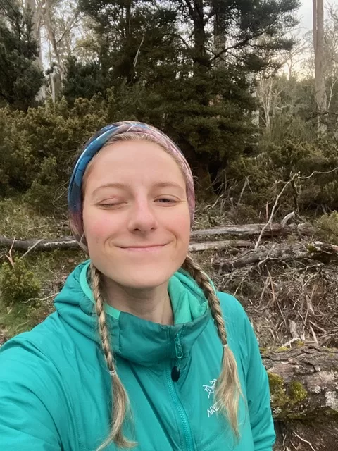 Woman hiking in nature with a closed (injured) eyelid