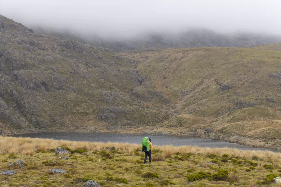 Man walking in front of Little Lake Sylvester