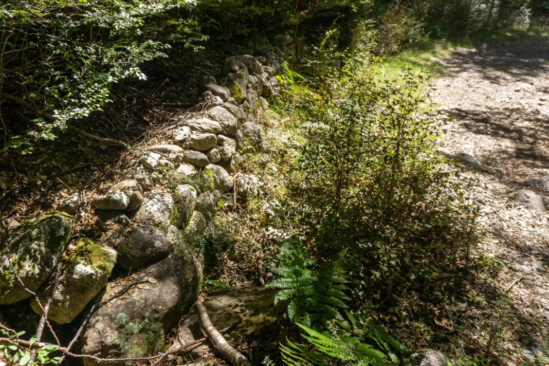 Old stone wall on side of 4WD track