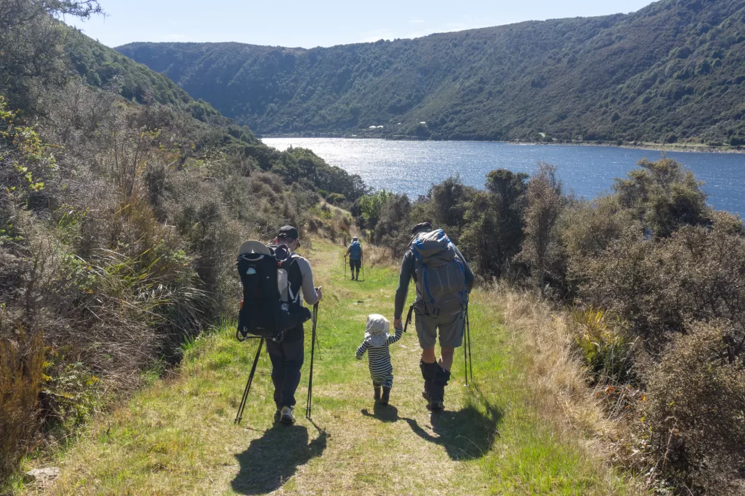 Family walking next to the Cobb Reservoir