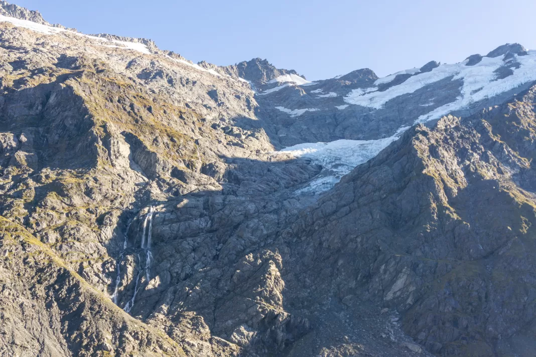 Hesse Glacier with waterfalls cascading down the cliffs