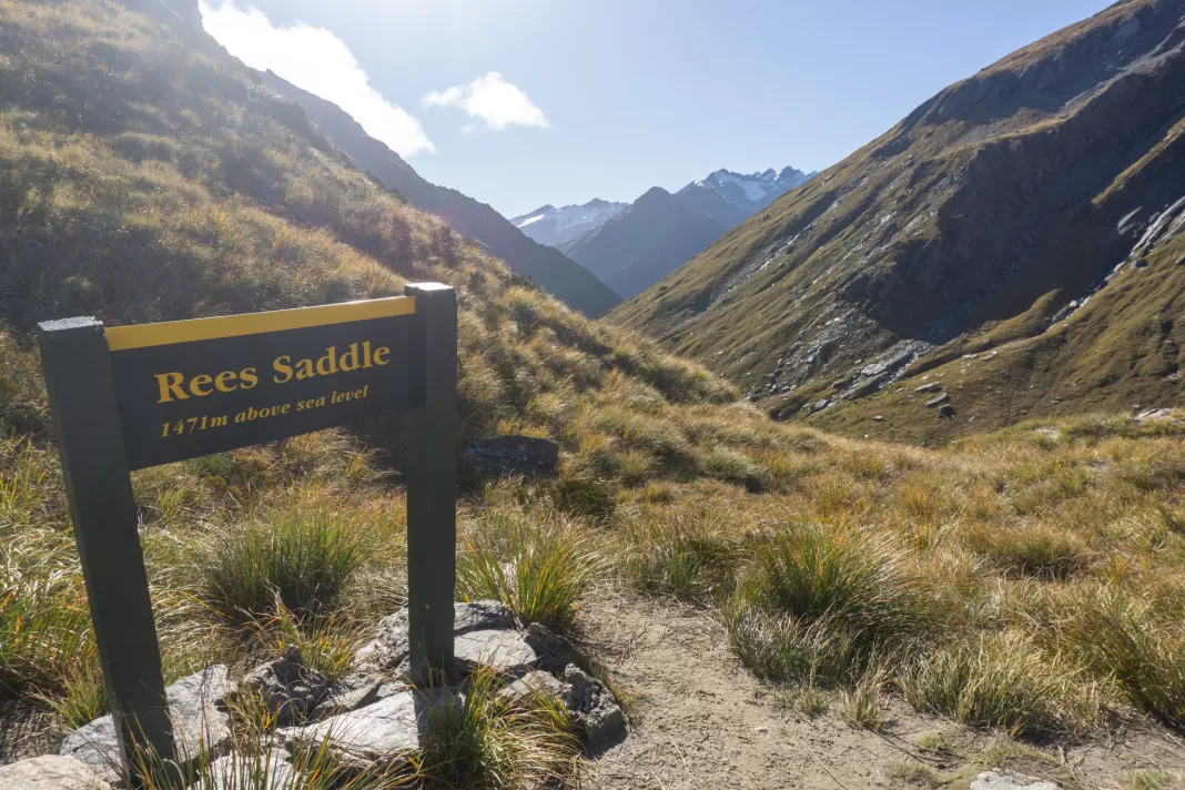DOC sign on the Rees Dart track which reads "Rees Saddle, 1471m above sea level"
