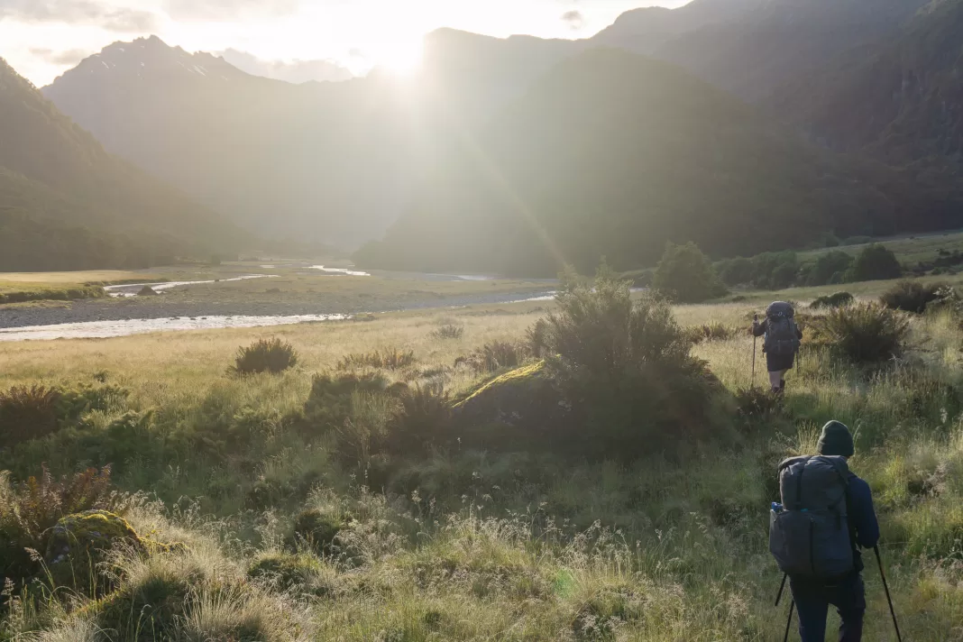 Trampers at sunrise on the Wilkin River Track